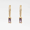 Arete dorado de acero inoxidable con zirconia morada
