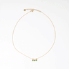 Collar dorado de acero inoxidable con zirconias verdes