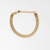 Pulsera dorada de acero inoxidable con zirconias