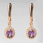 Arete de acero inoxidable con zirconias moradas y blancas