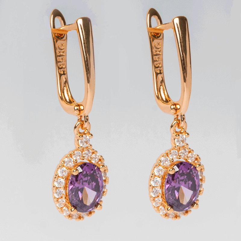 Arete de acero inoxidable con zirconias moradas y blancas