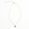 Collar dorado con dije en forma de ojo en color azul