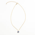 Collar dorado con dije en forma de ojo en color azul