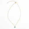 Collar dorado con dije en forma de ojo en color turquesa