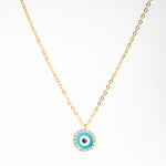Collar dorado con dije en forma de ojo en color aqua