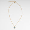 Collar dorado en chapa de oro con dije en forma de corazón en color azul