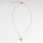 Collar dorado en chapa de oro con dije en forma de corazón en color azul