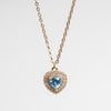 Collar dorado en chapa de oro con dije en forma de corazón en color azul