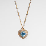 Collar dorado en chapa de oro con dije en forma de corazón en color azul