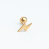 Piercing dorado en forma de rayito