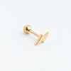 Piercing dorado en forma de rayito