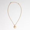 collar dorado con perla