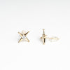 Aretes de Plata en color dorado en forma de estrellas de 4 puntas