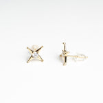 Aretes de Plata en color dorado en forma de estrellas de 4 puntas
