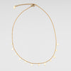 collar dorado de acero inoxidable con dijes miniatura en dorma de gotas