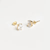 Aretes tipo studs color dorado con zirconia ovalada
